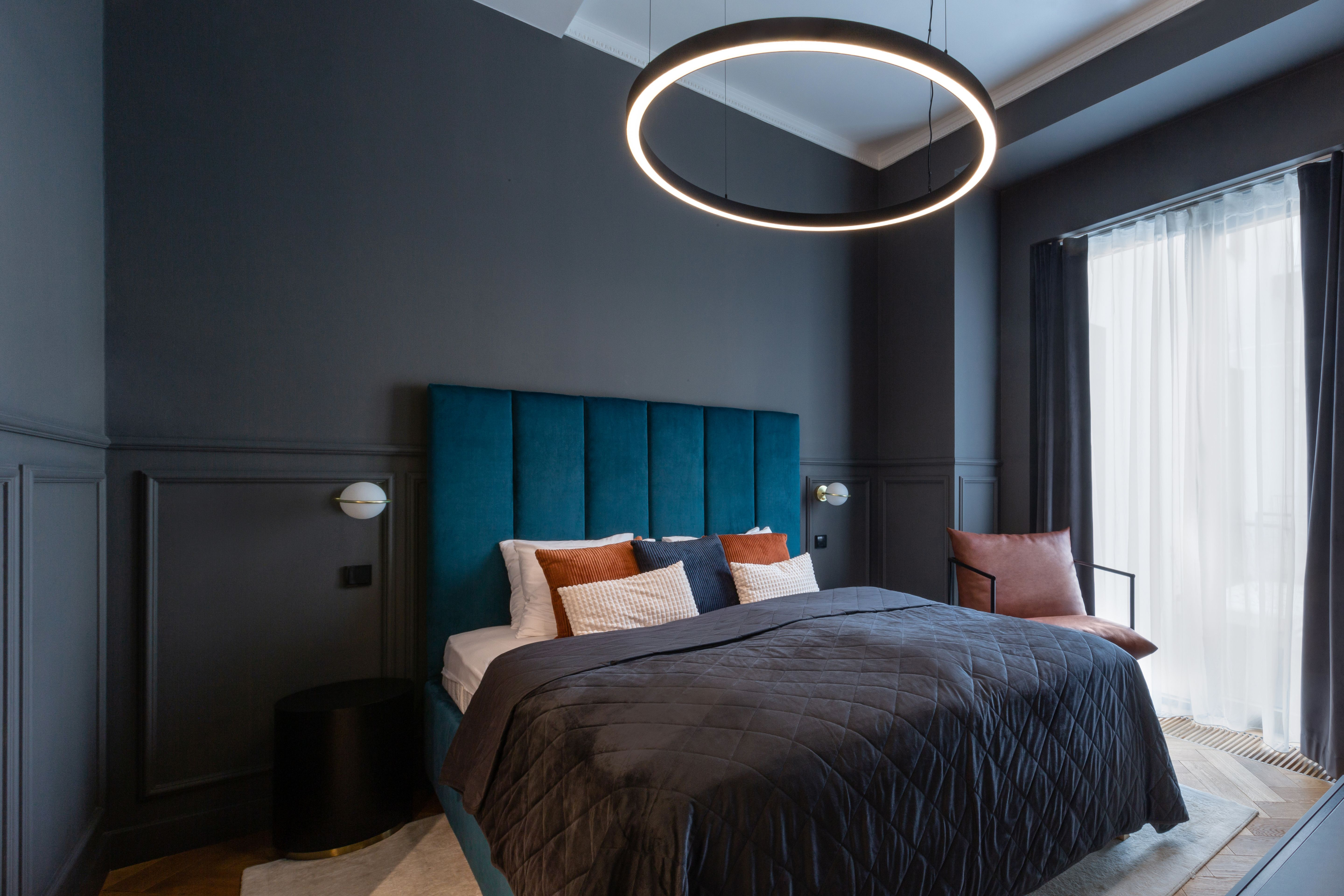 Premium room with a double bed and warm lighting